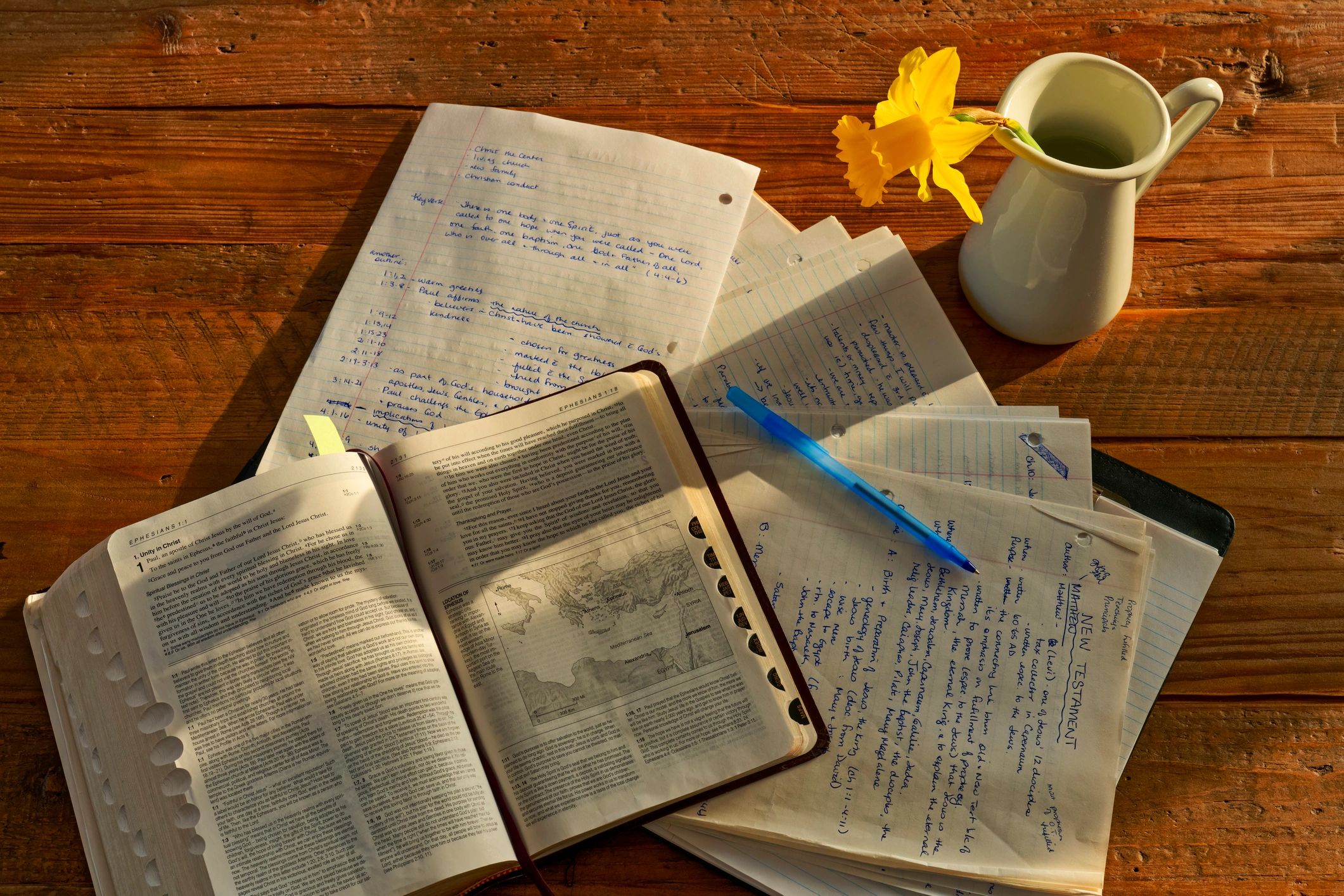 Open Bible and notes on a desk