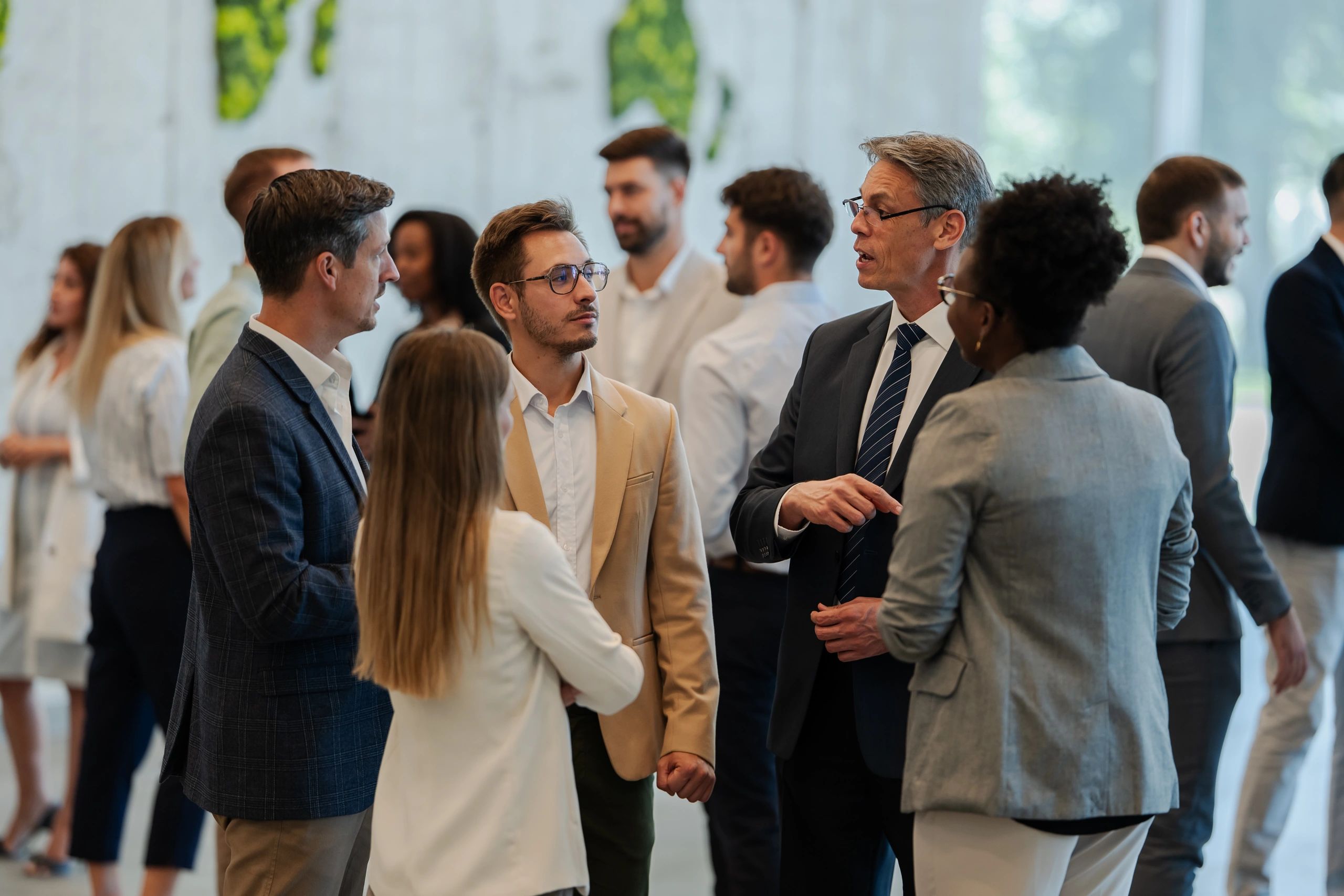 Group of professionals networking and talking